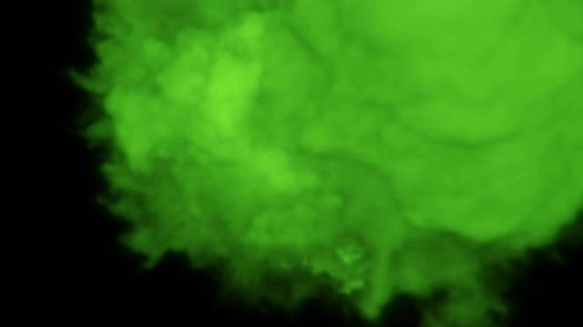 Green 3D smoke explosion shockwave effect and divergent wave isolated on black background. Abstract smoke explosion animation with alpha channel. Top camera view from above. 
