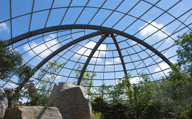 large aviary set against a blue sky