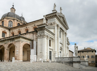 Obraz premium View of the facade and the cupola of the neoclassical Duomo di Urbino, Urbino Cathedral in the Marche region, Italy.