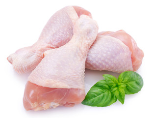 Raw chicken legs on white background