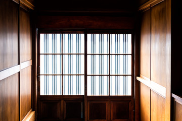 Traditional japanese machiya house or ryokan with sliding paper door entrance and light with nobody...