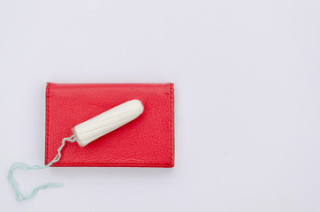 Menstruation tampon on a white background, women's days, critical days. Care for hygiene during menstruation. Copy space