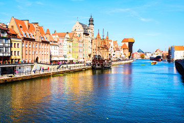 A clear summer day in the old town of Gdansk, Poland, with boats moored