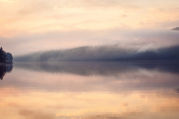 Fototapeta na wymiar Beautiful reflections of a lake on early morning