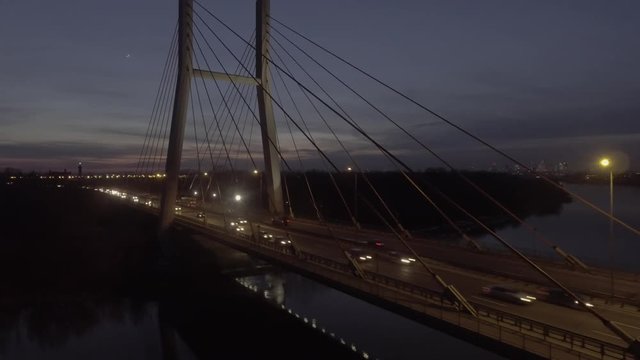 4K. Aerial view of the Siekierkowski bridge with the city of Warsaw Poland. night time