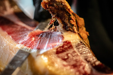 cutting and serving Spanish Iberian ham