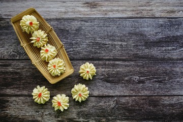 Obraz na płótnie Canvas A malay traditional cookies called Kuih Semperit Dahlia served during Eid Fitri. Top view and flat lay concept.