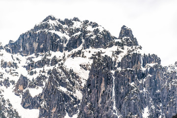 Takayama, Japan Mountain snow with view in Gifu Prefecture park with cloudy sky and rocky cliff