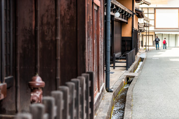 Fototapeta premium Takayama, Japan small canal gutters in Gifu prefecture view of traditional houses in mountains in city