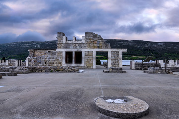 Knossos Palace, Crete / Greece. Archaeological site of Knossos in Heraklion at sunset. Cloudy sky