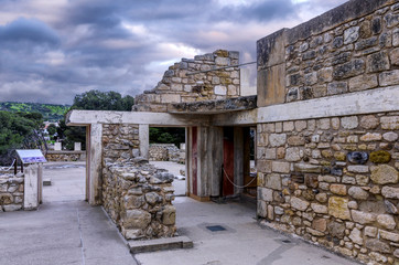 Knossos Palace, Crete / Greece. Archaeological site of Knossos in Heraklion at sunset. Cloudy sky