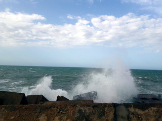 waves crashing on rocks