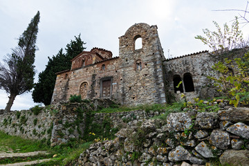 Fototapeta na wymiar Part of the byzantine archaeological site of Mystras in Peloponnese, Greece. View of the Evangelistria Church in the middle city of ancient Mystras