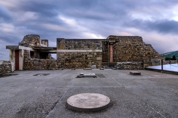 Knossos Palace, Crete / Greece. Archaeological site of Knossos in Heraklion at sunset. Cloudy sky