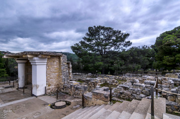 Knossos Palace, Crete / Greece. South Propylaeum restored building with the two frescoes at the archaeological site of Knossos in Heraklion. Sunset, cloudy sky
