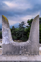 Knossos Palace, Crete / Greece. The sacred Bull Horns sculpture (symbol of power for the Minoans) next to the South Propylaeum building at the archaeological site of Knossos. Sunset