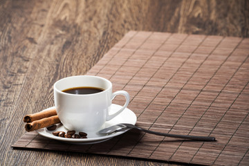 Cup of espresso coffee on wooden table