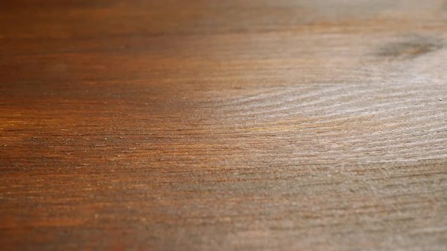 Brown painted wooden surface with glare of the sun as background