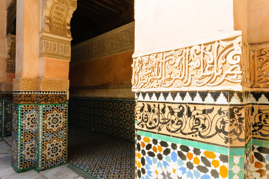 Mosiacs, and carved stonework dictating Arabic poetry outside a building in Marrakech