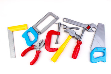 Toy. professional repairing implements for decorating and building renovation set on the on white background. Electrical tools. Top view. Copy space for text.