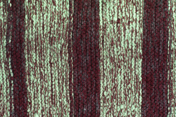 Obraz premium Sweater or scarf fabric texture large knitting. Knitted jersey background with a relief pattern. Wool hand- machine, handmade.
