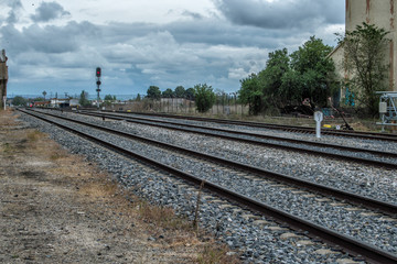 Fototapeta na wymiar landscape withl train tracks in the station of Torrijos, province of Toledo. Castilla la Mancha. Spain