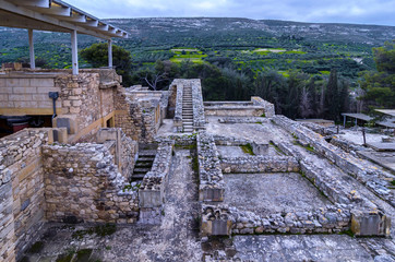 Knossos Palace, Crete / Greece. View of the archaeological site of Knossos in Heraklion at sunset. cloudy sky