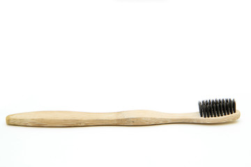 A toothbrush from natural materials. Made from bamboo wood. Isolated on a white background.  