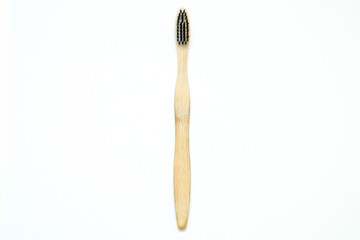 A toothbrush from natural materials. Made from bamboo wood. Isolated on a white background.  