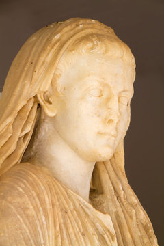 Detail of a marble Roman statue in the museum at Gortys, Crete, Greece, Europe; face of the young Caligula