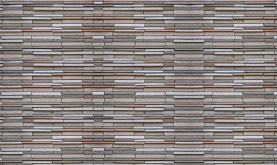 Modern slim design brick block masonry fence wall texture background.