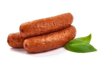 German traditional smoked sausages with basil leaves, dry meat, close-up, isolated on white background
