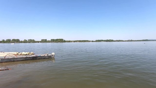 Beautiful Danube river in Zemun municipality in Belgrade, Serbia. Small anchored fishing boats.