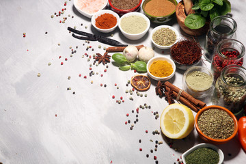 Fototapeta na wymiar Spices and herbs on table. Food and cuisine ingredients with basil