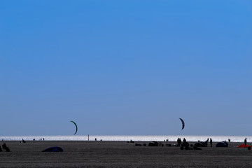Land sailing or sand yachting on beach at evening