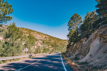Driving through the mountains. Spanish scenery,hills and blue sky. Mediterranean landscape