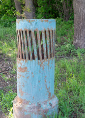 Fototapeta premium old street vent tube painted green. background, industrial.