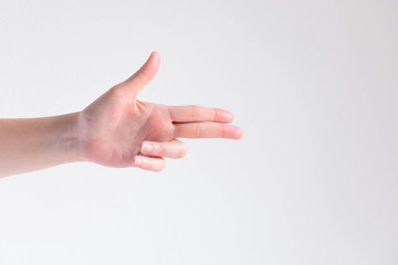 A hand pose to be gun shape on white background.