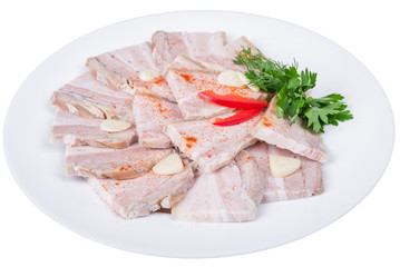 Sliced baked meat with garlic in a plate