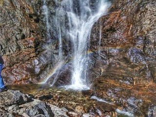 Majestic and a soothing waterfall with a rainbow