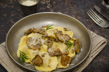 Ravioli with mushrooms and gorgonzola cheese, Italian cuisine 