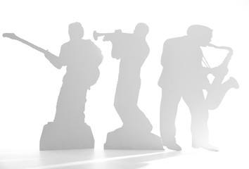 Shadow of a musician on white background