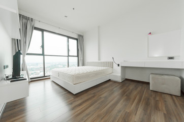 Fototapeta na wymiar Modern bedroom in luxury apartment