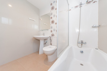 Naklejka na ściany i meble Condo bathroom design with single vanity cabinet and grey tiles on the walls.