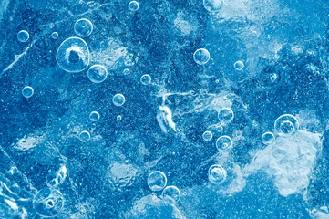 Texture abstract closeup background ice with grooves, furrows, and bubbles of air cought by frost...
