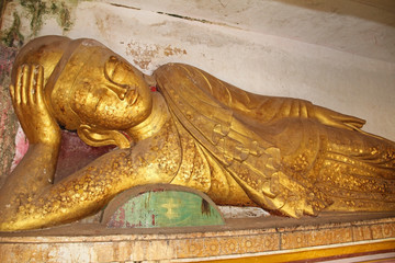Fototapeta premium Old golden Buddha statue at Pho Win Taung Caves, Monywa city, Sagaing State, Myanmar, Asia.