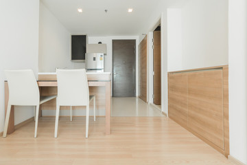 Stylish kitchen interior with dining table and chairs