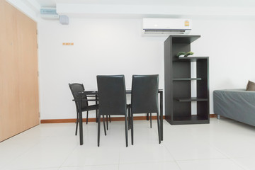 Stylish kitchen interior with dining table and chairs