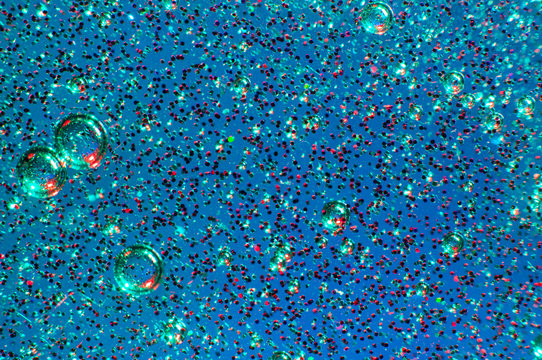 Blue slime with glittering multicolor particles
