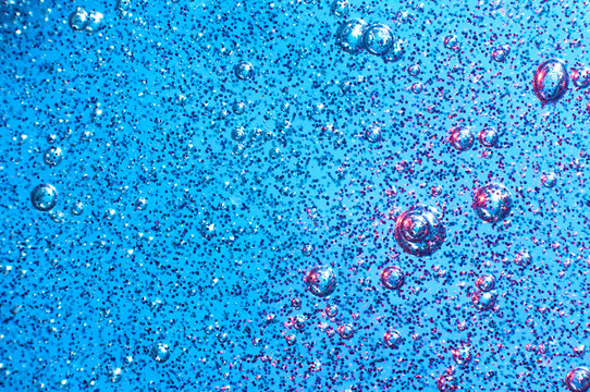 Blue slime with glittering multicolor particles